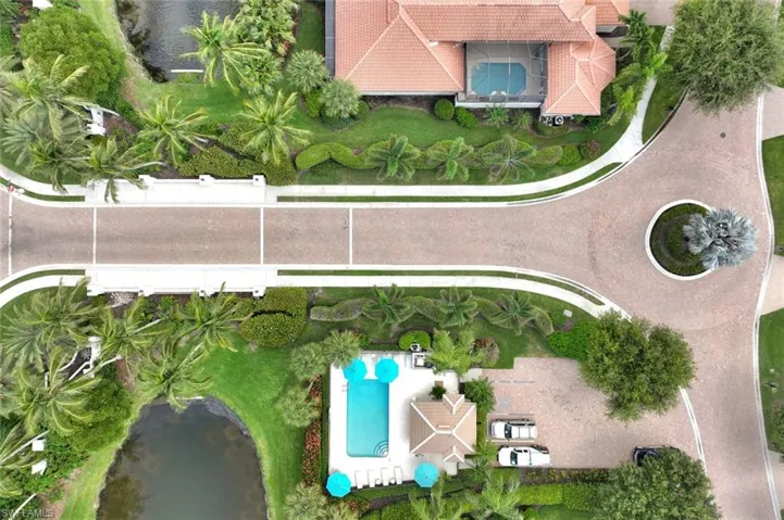 Aerial view of bridged entrance to Troon Lakes and Common Community Pool and entertainment area
