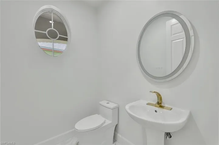 Bathroom with marble tile.