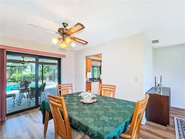 Dining room featuring light wood-type flooring, a wealth of natural light, and ceiling fan