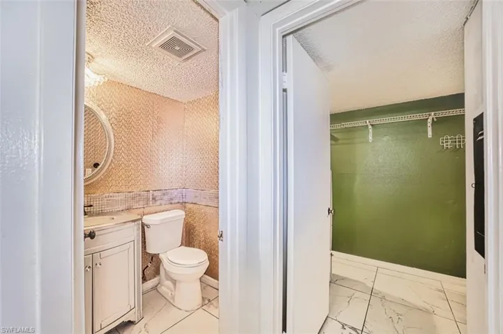 ENTRANCE HALLWAY to POWDER ROOM and LAUNDRY ROOM