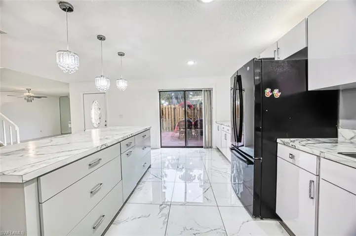 KITCHEN VIEW OVERLOOKING COURTYARD and MAIN LIVING AREA
