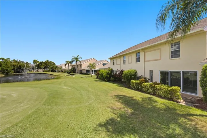 View of grassy yard featuring a water view and golf course view
