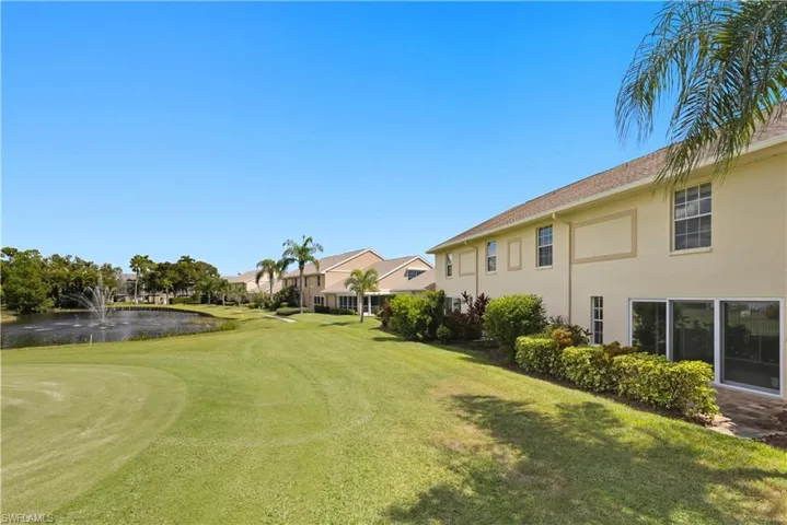 Expansive green lawn with a golf course putting green