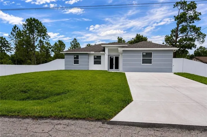 Contemporary single-story residence featuring a gray and white exterior