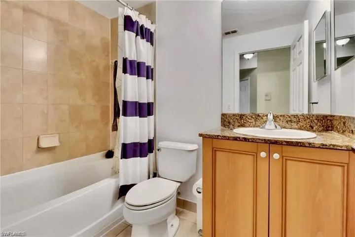Full bathroom with vanity and shower / bath combo