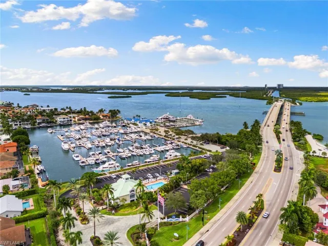 View of property location with a marina and a nearby body of water