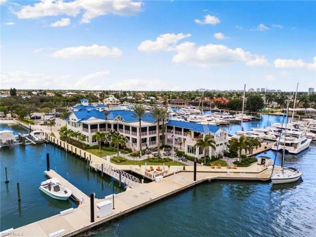 Dock with view of marina and a water view