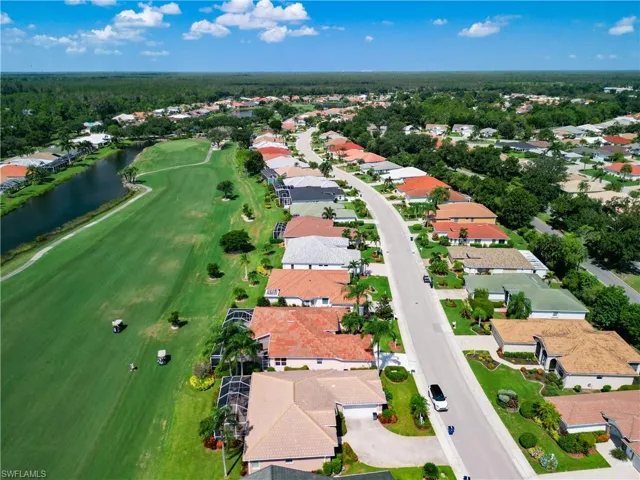 Aerial view featuring golf course/water view