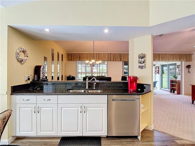 Kitchen featuring sink, a wealth of natural light, and stainless steel dishwasher