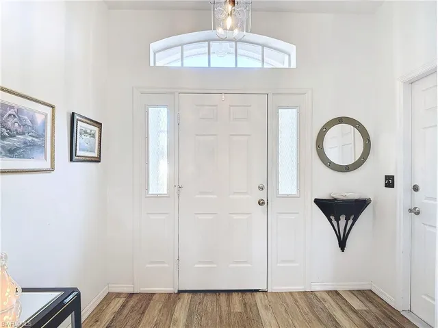 Foyer featuring luxury vinyl flooring