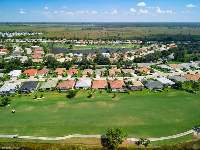 Aerial view of golf course and back of house