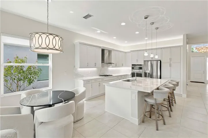 gourmet kitchen, wall ovens, island, quartz counters, soft close cabinets