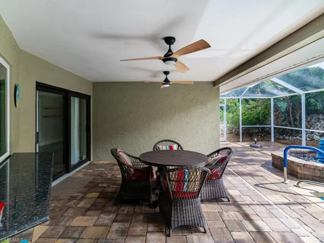 View of patio / terrace with a lanai and ceiling fan