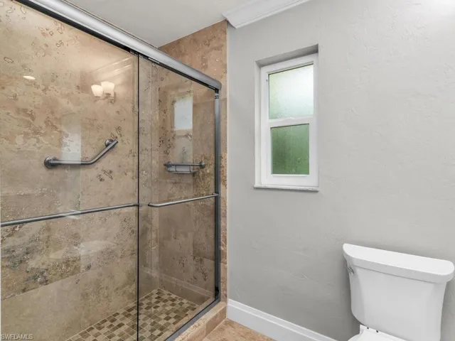 Bathroom with walk in shower and toilet