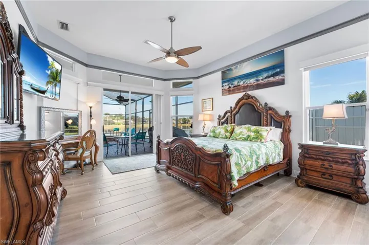 Bedroom featuring access to outside and ceiling fan