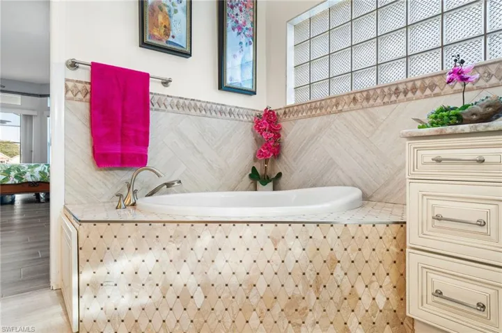 Bathroom featuring tiled tub