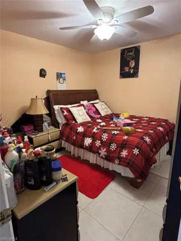 Tiled bedroom with ceiling fan