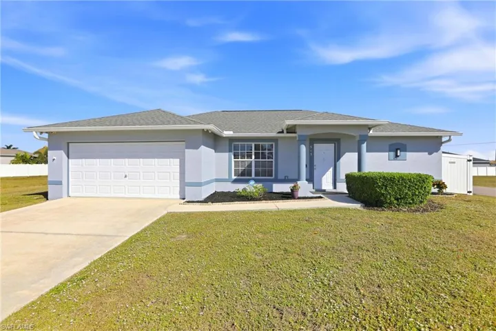 Ranch-style house with stucco siding, driveway, an attached garage, and a shingled roof