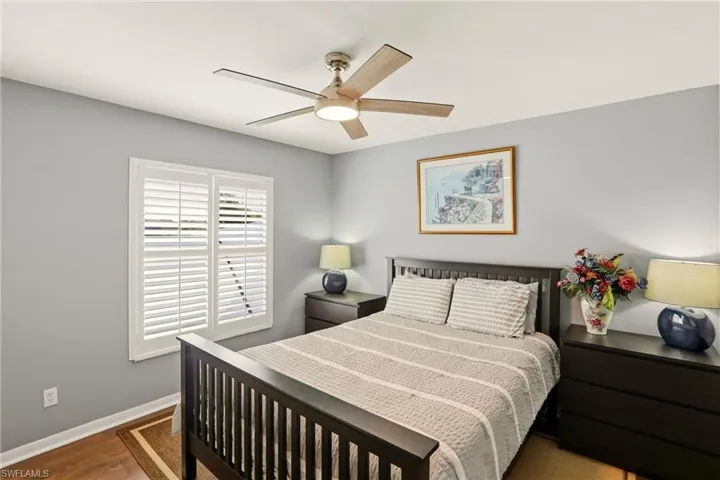 Bedroom featuring a ceiling fan and wood finished floors