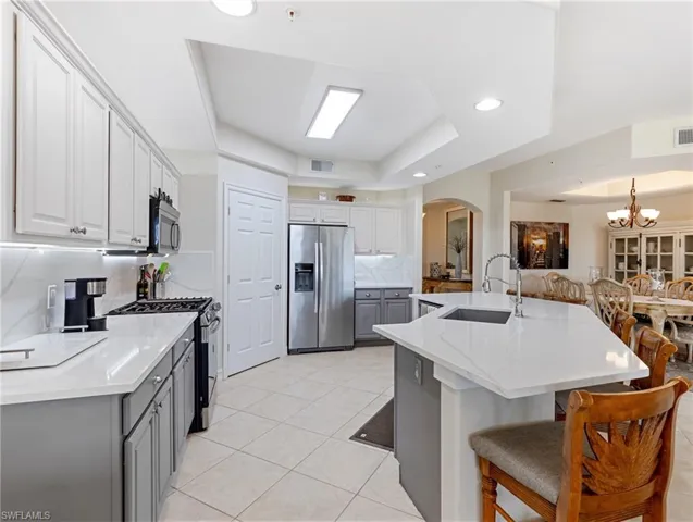 Kitchen featuring arched walkways