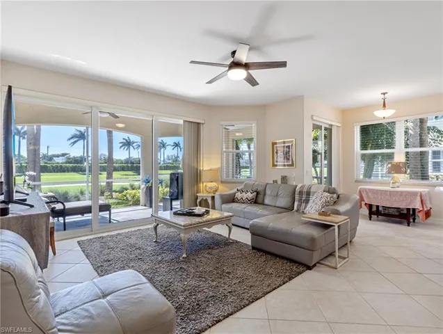 Living room plenty of natural light, and ceiling fan