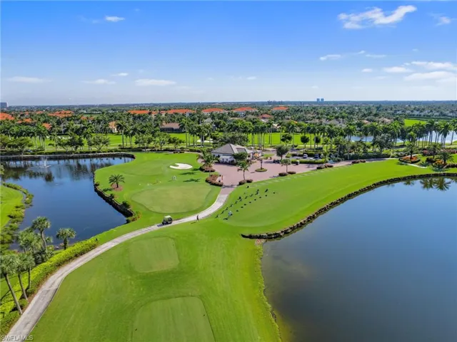 Birds eye view of property  golf course and a water view
