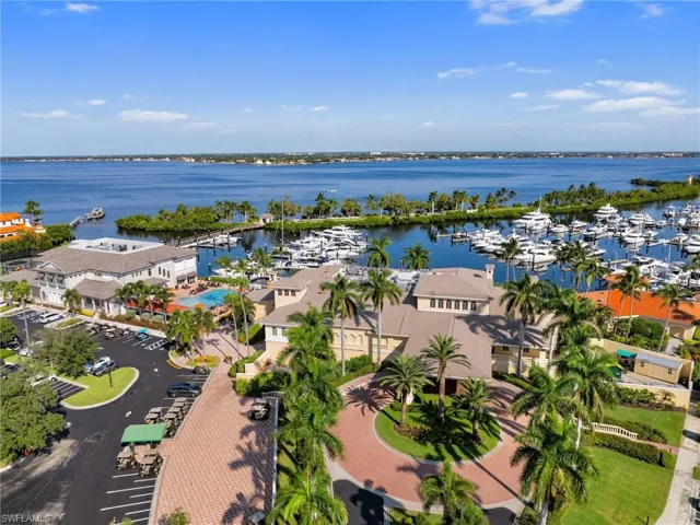 Bird's eye view featuring a water view restaurant, pool, Gymnasium/Spa and Marina