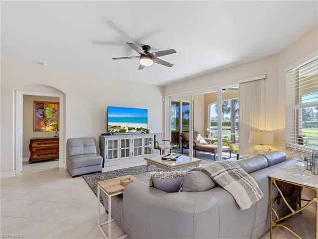 Living room featuring ceiling fan