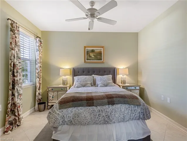 bedroom featuring ceiling fan oversized closet