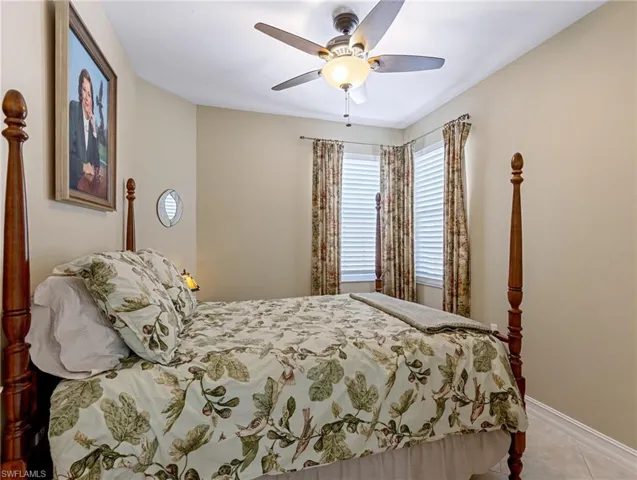 Bedroom with a ceiling fan and double closet that is extra deep and wide