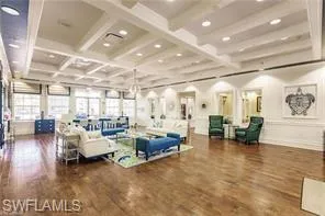 Building lobby with coffered ceiling, beamed ceiling, and recessed lighting