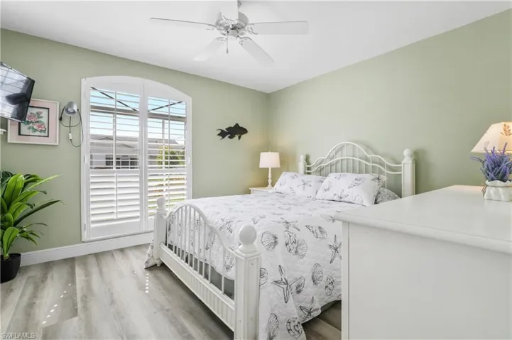 Bedroom with wood finished floors and a ceiling fan