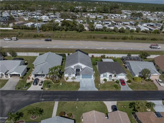 Aerial overview of property's location featuring nearby suburban area