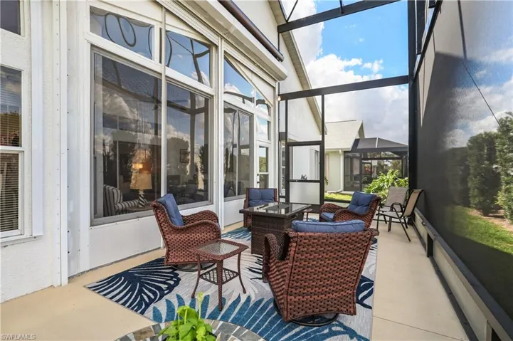 Sunroom featuring outdoor lounge area, healthy amount of natural light, and a patio