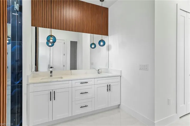 Bathroom with dual bowl vanity