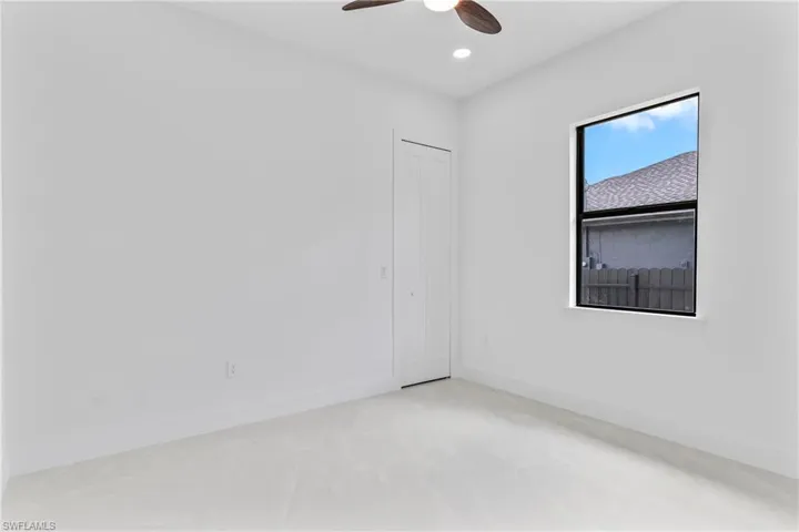 Spare room with ceiling fan