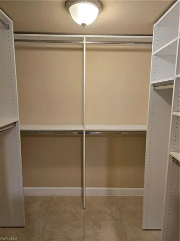 Master Walk in Closet with Custom Shelving