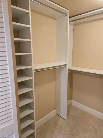 Master Walk in Closet with Custom Shelving