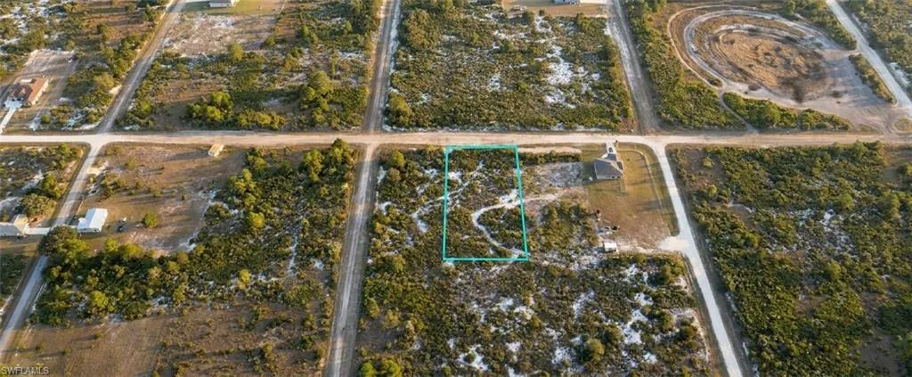 Expansive undeveloped lot featuring natural vegetation and street access