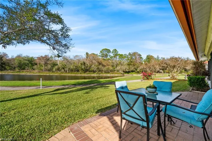 View of patio with a water view