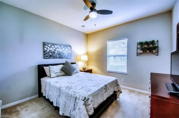 Bedroom featuring carpet floors and a ceiling fan