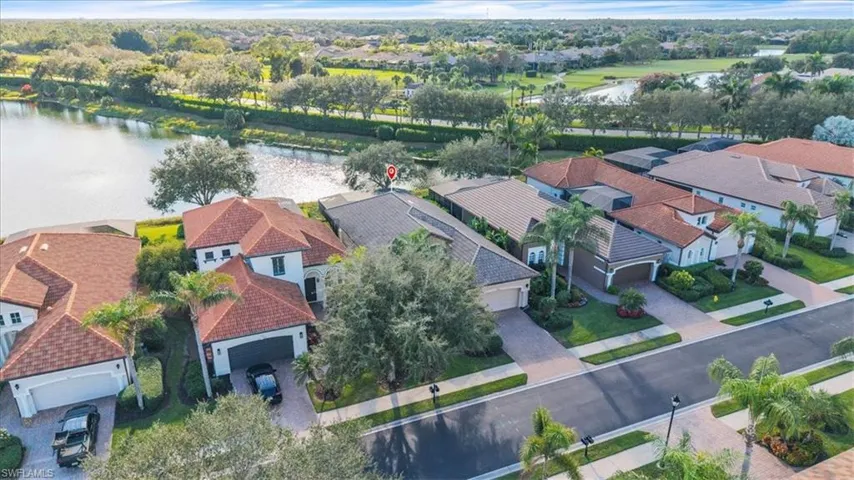 Aerial view of residential area featuring a large body of water