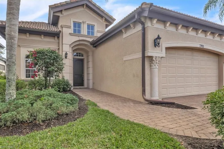 Mediterranean / spanish home featuring stucco siding, an attached garage, a tile roof, and decorative driveway