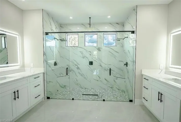 Bathroom with vanity and an enclosed shower