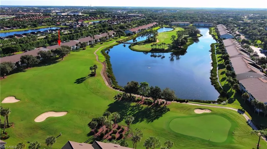 Aerial overview of property's location with a golf club, a nearby body of water, and nearby suburban area