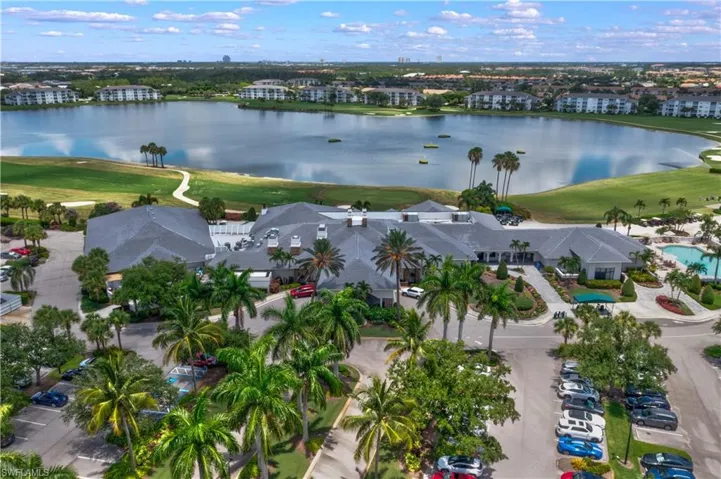 View of property location featuring a golf club and a large body of water