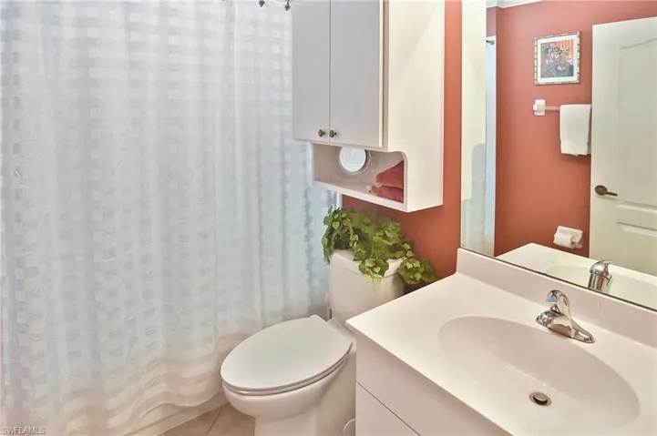 Full bathroom with vanity and a shower with curtain