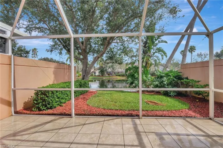 Unfurnished sunroom with a water view