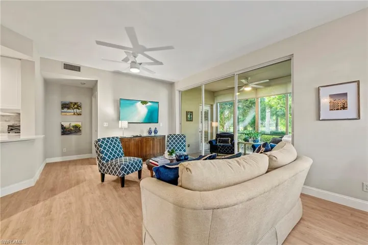 Living room featuring light hardwood / wood-style floors and ceiling fan