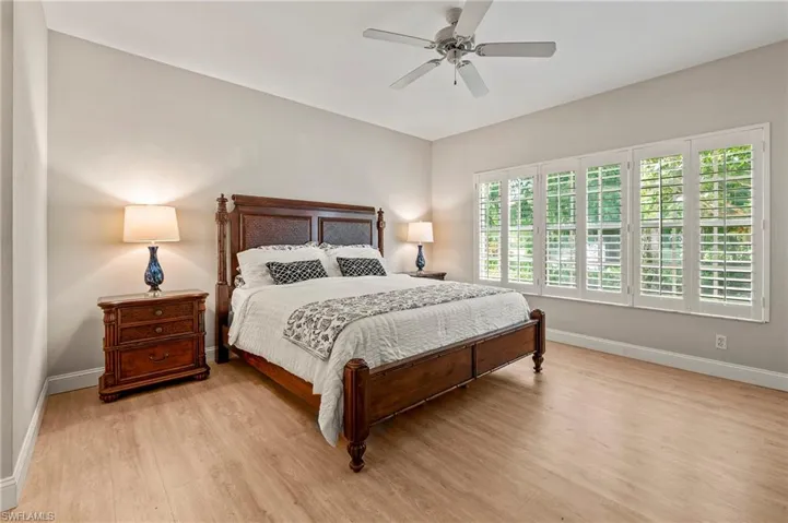 Bedroom with wood-type flooring and ceiling fan